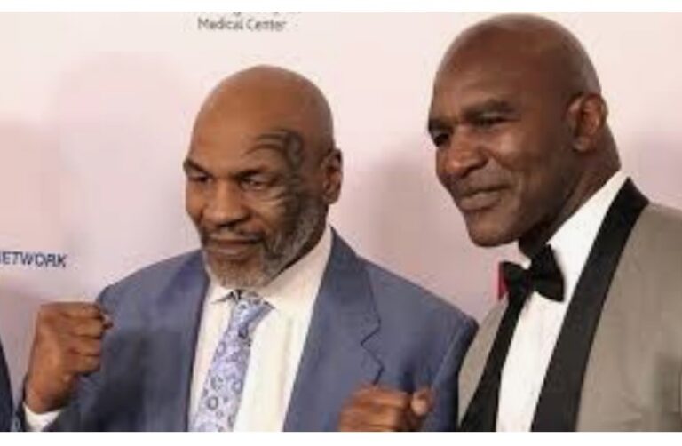 Last November, Tyson returned to the ring in support of a new promotion — Mike Tyson's Legends Only League. At the time, Tyson planned to support legendary athletes across all sports by hosting special one-time events. Tyson took on boxing legend Roy Jones Jr. in an exhibition bout that ended in a draw. Despite the draw, the Tyson/Jones fight was well-received by fans, on its way to becoming 2020's largest pay-per-view event. The entire card reportedly made around $80 million in pay-per-view sales. After some back-and-forth; to which Evander Holyfield team allegedly pulled out of negotiations 24 hours ago. Mike Tyson, has confirmed that the fight is happening. Appearing on Instagram live with Haute Living, Tyson confirmed saying, “I just want everybody to know the fight is on with me and Holyfield. Holyfield’s a humble man I know that and he’s a man of God, but I’m God’s man. Listen, I’m going to be successful May 29.” Originally, the exhibition match was canceled as it was reported that Tyson’s camp was asking for $25 million USD. Plus other “demands” that became “untenable” which ultimately led to the falling apart of the promotion. Whatever changed in the deal has not yet been made public but boxing fans are excited about this trilogy match. The last time these two competed against each other was in the rematch of 1997. Often referred to as “The Bite Fight.” Tyson ended up biting a piece off of Holyfield’s ear during a clinch. Tyson, at 54 years of age, last fought in November against Roy Jones Jr. while the 58-year-old Evander Holyfield’s last professional fight was in 2011. This fight is expected to take place on May 29 at the Hard Rock Stadium in Miami.